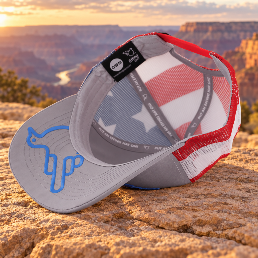 The Stars & Stripes American Bird Trucker, Gray, underbird on sandstone with a canyon background.