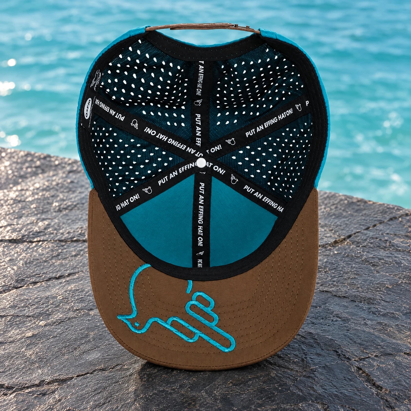 Hat Turquoise/Brownish Gray — underside showing Under Bird artwork