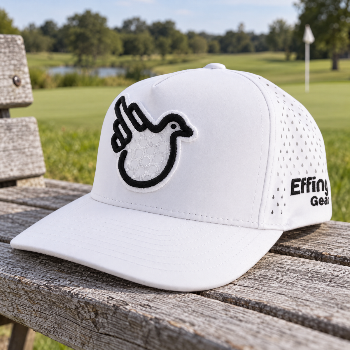Bye Bye Birdie golf hat with its raised golf-ball Bird on a timber golf-course bench.
