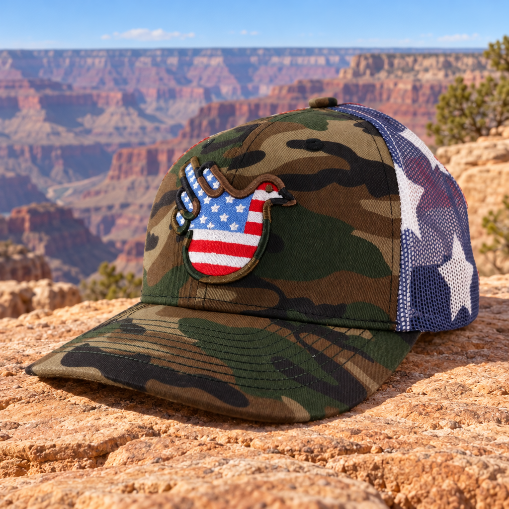 The Camo Stars & Stripes American Bird Trucker Camo/Camo Outline front in the reviewed generated USA sandstone and canyon setting.