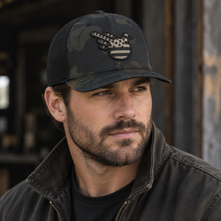 Storm Camo Fitted Trucker worn outdoors with American Bird embroidery